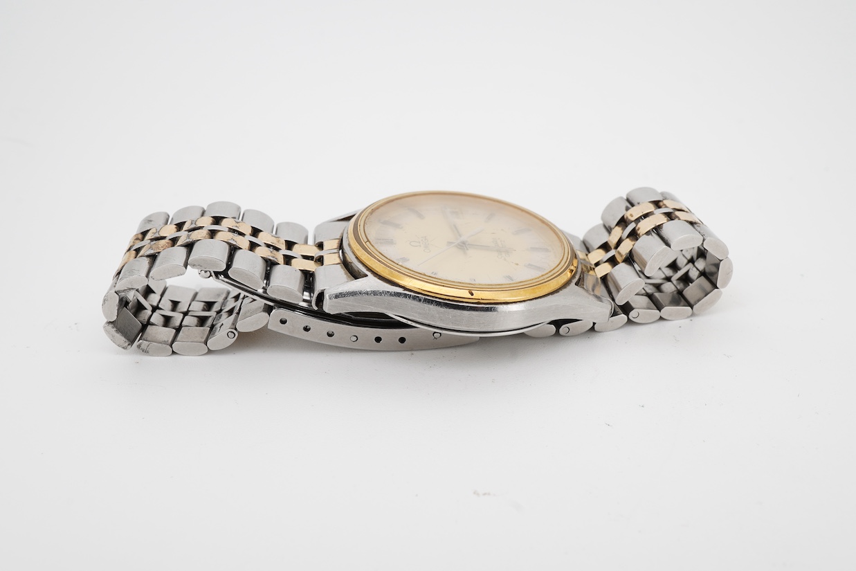 A gentleman's early 1980's stainless steel and gold plated Omega Seamaster quartz wrist watch, with baton numerals and date aperture, movement c.1337, case diameter 34mm, on a steel and gold plated Omega bracelet, with s